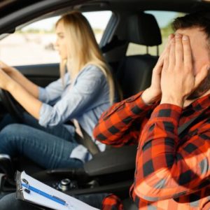 woman-and-scared-instructor-in-car-driving-school-2021-08-28-20-00-46-utc-600x399